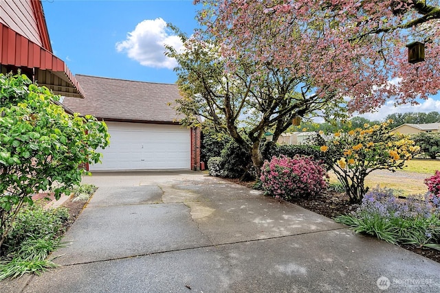 garage featuring driveway
