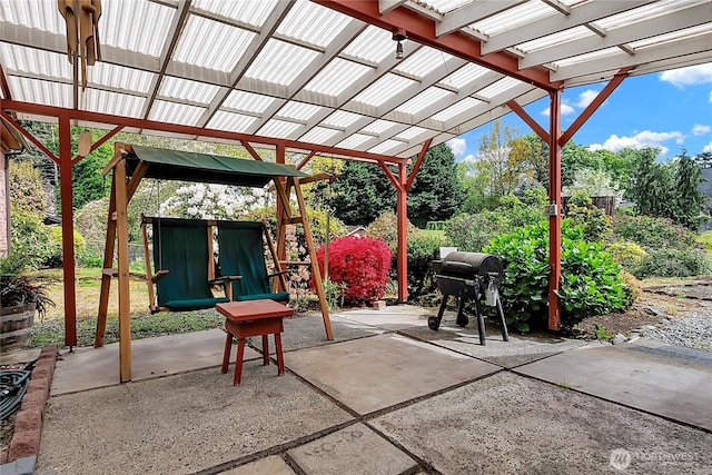 view of patio featuring grilling area and a pergola