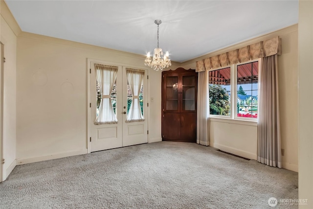 interior space featuring french doors, baseboards, a notable chandelier, and visible vents