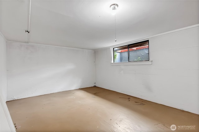 spare room featuring concrete flooring
