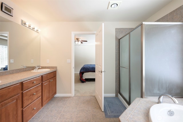 ensuite bathroom with vanity, connected bathroom, a stall shower, and a washtub
