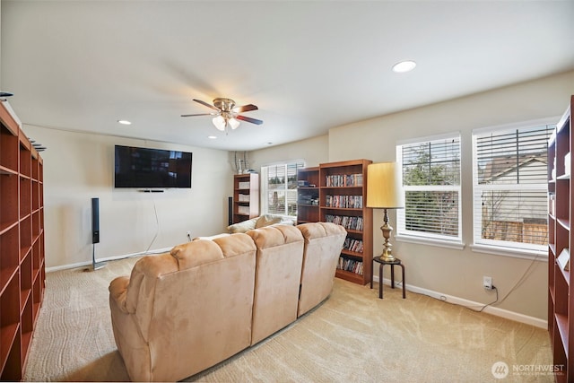 living room with recessed lighting, ceiling fan, light carpet, and baseboards