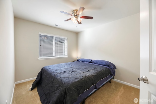 carpeted bedroom with baseboards, ceiling fan, and visible vents