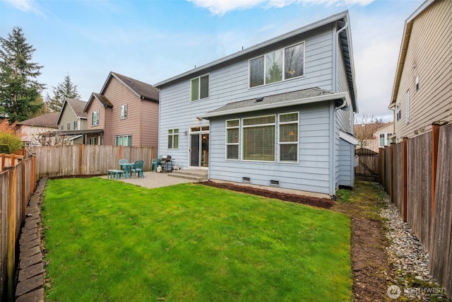 rear view of house with a patio, a fenced backyard, and a yard