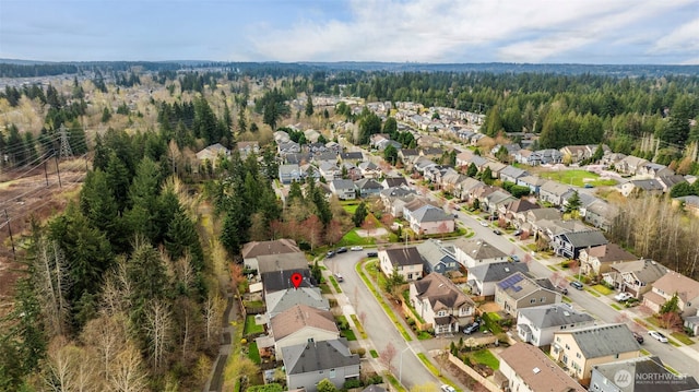 aerial view featuring a residential view and a forest view