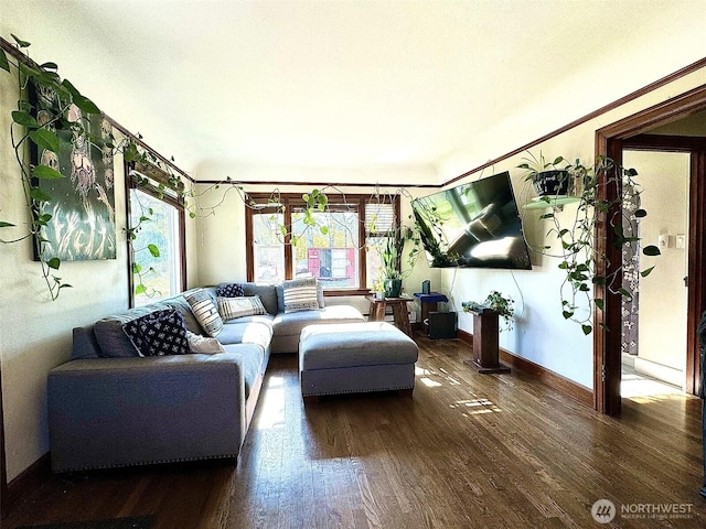 living area featuring wood finished floors and baseboards