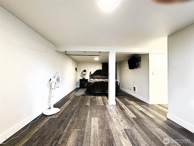 living area featuring wood finished floors and baseboards