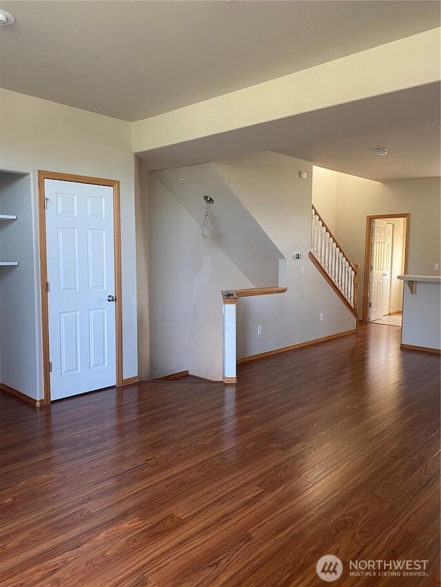 11406 SE 171st St Unit 14, Renton, WA 98058 - unfurnished living room with stairway, baseboards, and wood finished floors