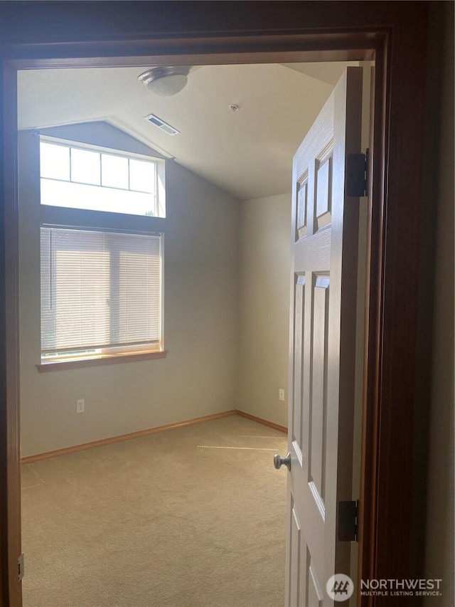 11406 SE 171st St Unit 14, Renton, WA 98058 - empty room with lofted ceiling, light carpet, visible vents, and baseboards