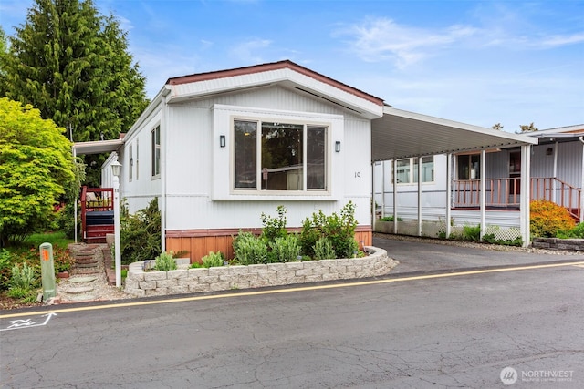 3832 164th St SW Unit 10, Lynnwood, WA 98087 - manufactured / mobile home featuring an attached carport and driveway