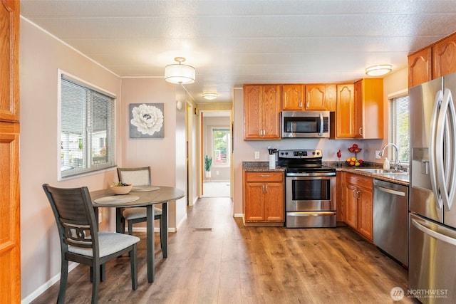 3832 164th St SW Unit 10, Lynnwood, WA 98087 - kitchen with a sink, plenty of natural light, stainless steel appliances, and wood finished floors