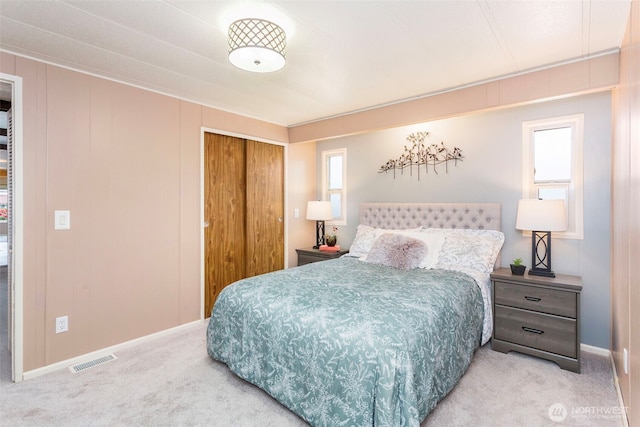 3832 164th St SW Unit 10, Lynnwood, WA 98087 - bedroom featuring visible vents, carpet flooring, baseboards, and a closet