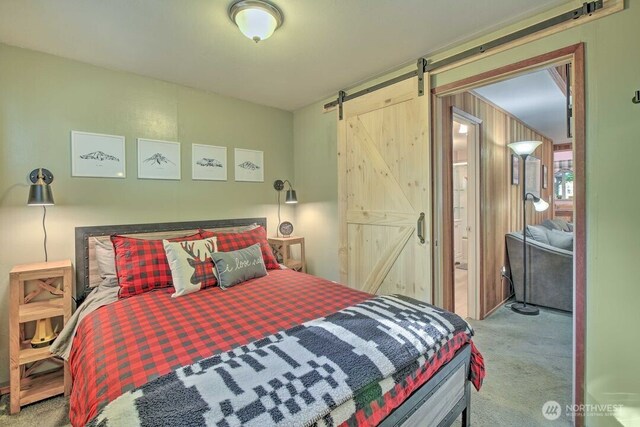 124 Aspen Ln, Packwood, WA 98361 - bedroom featuring carpet floors and a barn door