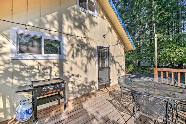 124 Aspen Ln, Packwood, WA 98361 - wooden deck featuring outdoor dining space