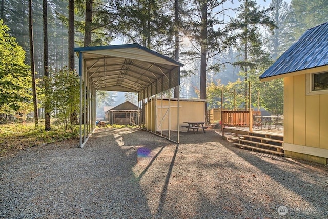 124 Aspen Ln, Packwood, WA 98361 - view of vehicle parking with fence, a storage unit, a carport, and driveway