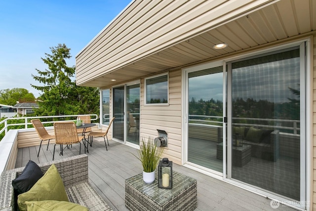 deck with outdoor dining space