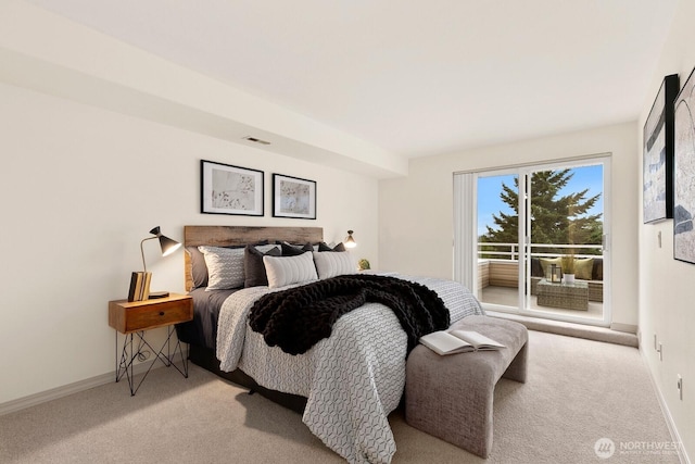 carpeted bedroom featuring access to outside and baseboards