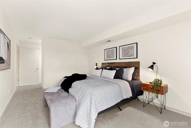 bedroom with carpet floors and baseboards