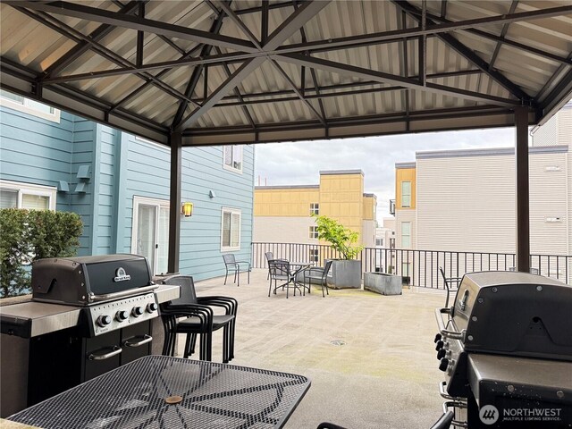view of patio / terrace with area for grilling, a gazebo, and outdoor dining space