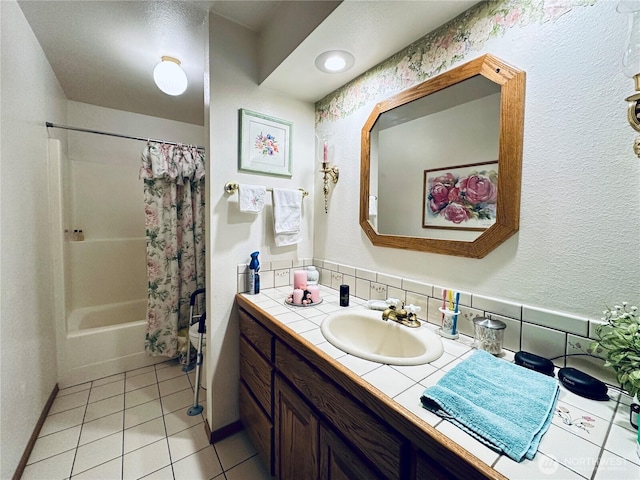 bathroom featuring vanity, shower / tub combo with curtain, and tile patterned floors