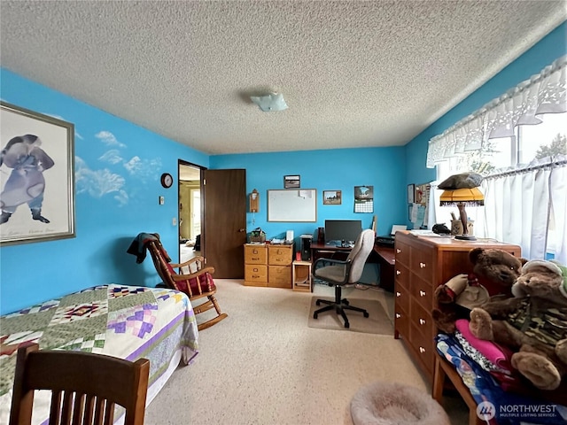 carpeted bedroom featuring a textured ceiling