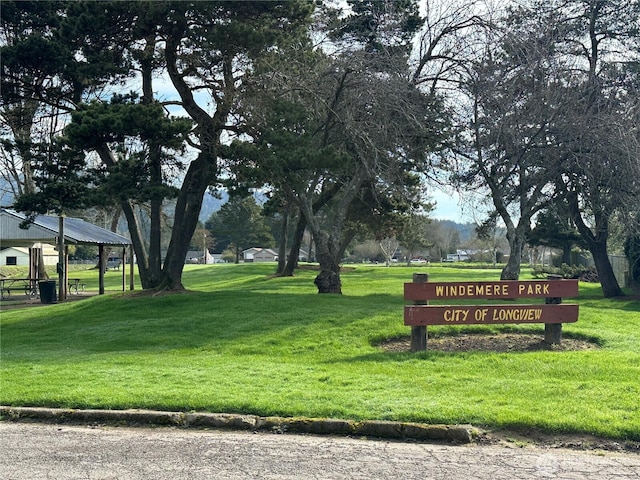 view of property's community with a lawn