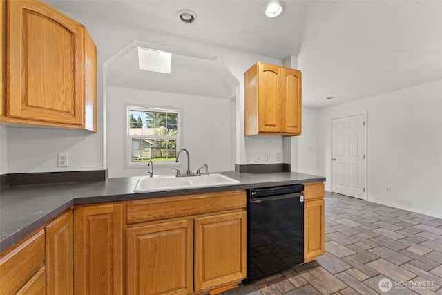 kitchen featuring a skylight, dark countertops, a sink, black dishwasher, and recessed lighting