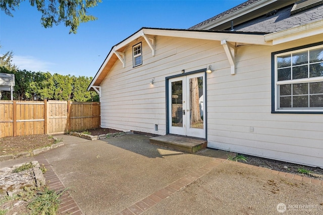 back of house featuring a patio, fence, and french doors