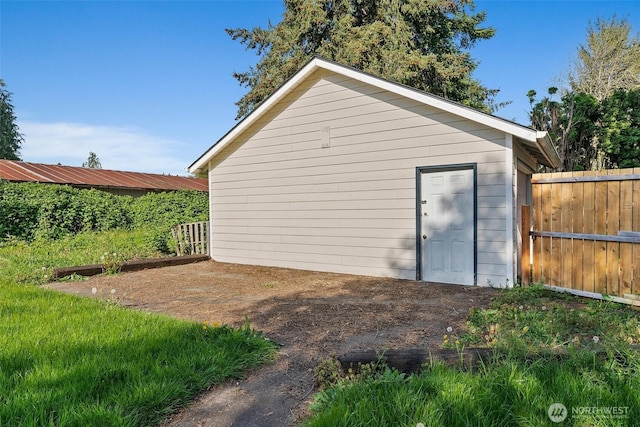 view of outdoor structure featuring fence