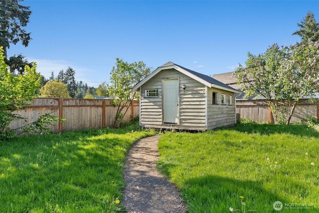 view of shed featuring a fenced backyard