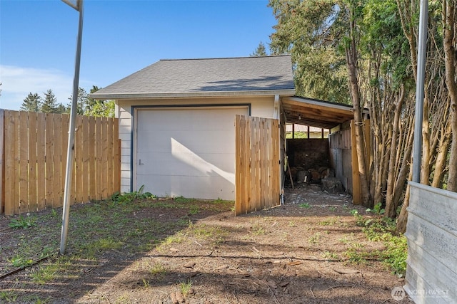 detached garage with fence