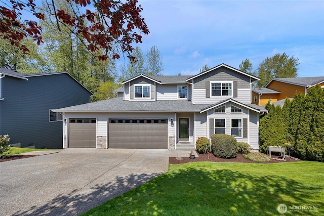 traditional home with roof with shingles, a front lawn, concrete driveway, an attached garage, and stone siding