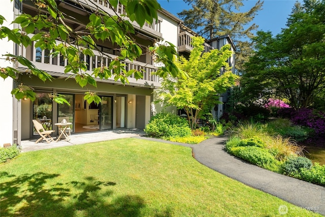 exterior space featuring a patio area and a balcony