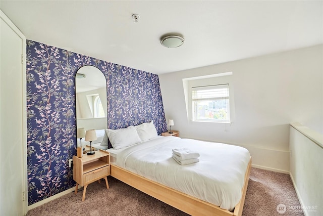 425 Vine St Unit 709, Seattle, WA 98121 - bedroom featuring baseboards, carpet, wallpapered walls, and arched walkways