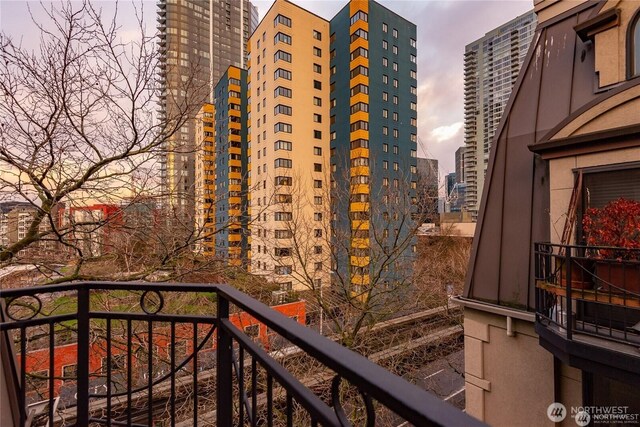 425 Vine St Unit 709, Seattle, WA 98121 - balcony at dusk featuring a city view