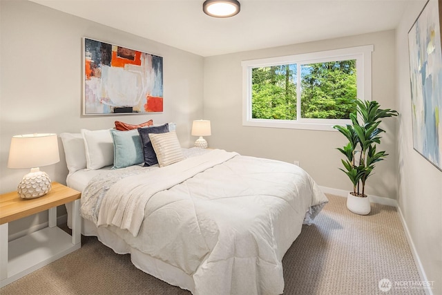 bedroom featuring carpet flooring and baseboards
