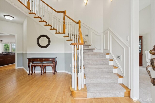 17600 NE 188th Ct, Brush Prairie, WA 98606 - staircase featuring a high ceiling and wood finished floors