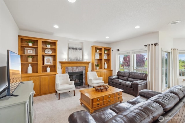 17600 NE 188th Ct, Brush Prairie, WA 98606 - living room with a healthy amount of sunlight, light carpet, a fireplace, and recessed lighting