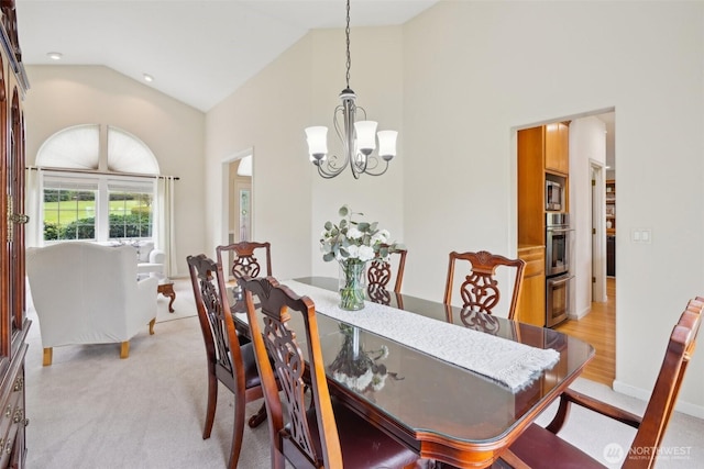 17600 NE 188th Ct, Brush Prairie, WA 98606 - dining room with light carpet, a notable chandelier, and high vaulted ceiling