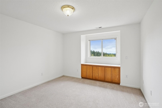 17600 NE 188th Ct, Brush Prairie, WA 98606 - spare room featuring visible vents, baseboards, and light carpet