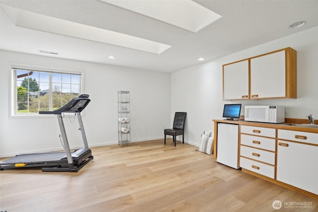 17600 NE 188th Ct, Brush Prairie, WA 98606 - workout area featuring recessed lighting, a skylight, visible vents, and light wood finished floors