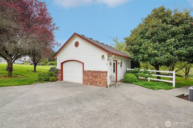 17600 NE 188th Ct, Brush Prairie, WA 98606 - view of side of property featuring an outbuilding, a detached garage, brick siding, fence, and concrete driveway