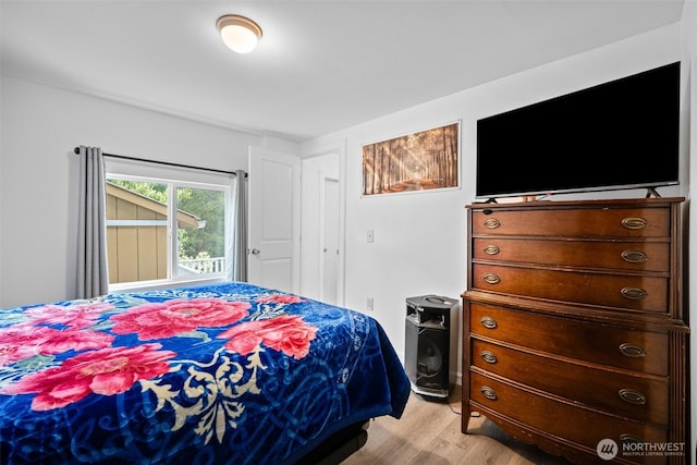 bedroom with light wood-style floors