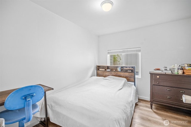 bedroom featuring wood finished floors