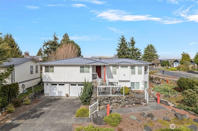 5726 Nakat Way, Blaine, WA 98230 - view of front of property featuring a garage, stairway, concrete driveway, a standing seam roof, and metal roof