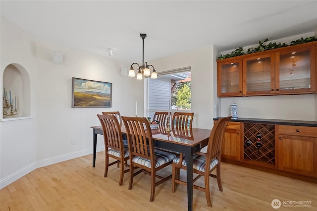 5726 Nakat Way, Blaine, WA 98230 - dining area with baseboards, a notable chandelier, and light wood finished floors