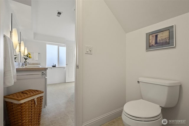 5726 Nakat Way, Blaine, WA 98230 - half bath with toilet, vaulted ceiling, and vanity