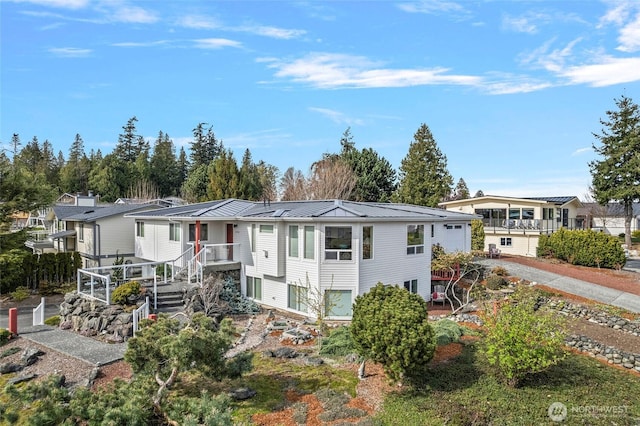 5726 Nakat Way, Blaine, WA 98230 - view of front of home with a garage, metal roof, and a standing seam roof