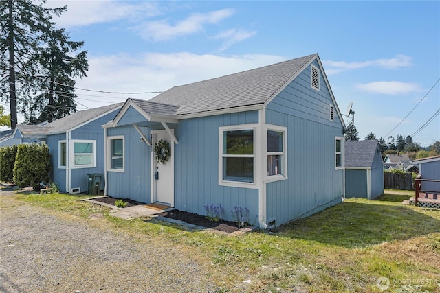 10704 5th Ave S, Tacoma, WA 98444 - bungalow-style home featuring a front yard and roof with shingles