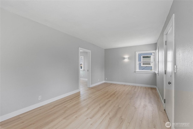 10704 5th Ave S, Tacoma, WA 98444 - empty room with baseboards and light wood finished floors